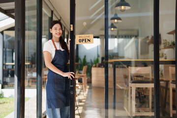 Woman cafe owner opening her small business welcoming customers
