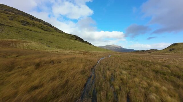 Eryri national park also known als Snowdonia, vast green valleys, ancient marshes and wild river streams. Dramatic landscape of North Wales, United Kingdom.