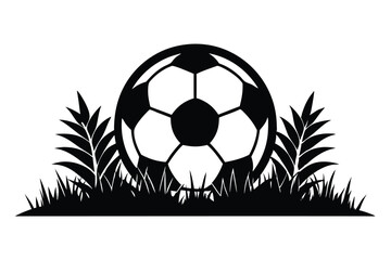 Obraz premium A silhouette reveals a soccer ball partially hidden within lush, wild grass and foliage