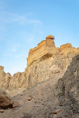 Fototapeta premium The Valley of Castles in the Charyn Canyon in Kazakhstan - Wild Nature, Desert Landscape, and Blue Sky.