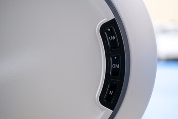 A detailed close-up of the operational and safety control panel on the main console of the ZEISS VISUMAX 800 Femtosecond Laser, featuring the emergency stop button, power button, and key