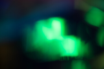 light leak overlay effect with green blurred light ,retro noisy film texture light leak flare on black background,abstract background with ray,grunge old film burn background