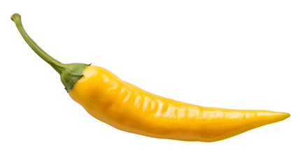 A single yellow chili pepper with a green stem isolated against a black background in sharp focus
