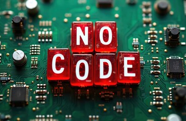 Red cubes spell no code on green electronic circuit board with microchips. Concept of low code development platforms for software creation. Represents visual programming, citizen developer tools,