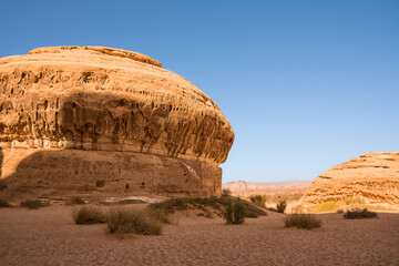 Sandstone formation shaped like a muffin or dome at the Hegra site in Saudi Arabia