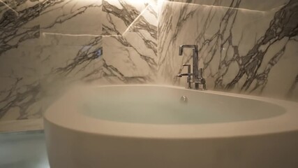 Steaming modern bathtub in luxury marble bathroom for relaxation and wellness, creating a serene spa experience for upscale living and interior design