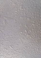 white, gray background covered with harmonic rain drops