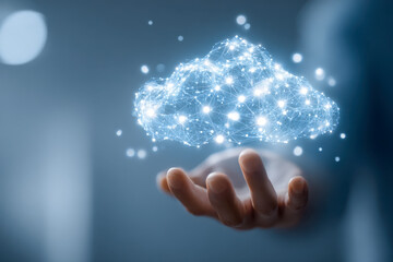 Person holding digital network cloud symbol glowing with interconnected data points representing futuristic technology and cloud computing concepts in blue tones