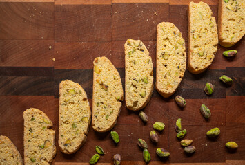 Flat Lay of Diagonal Biscotti Line with Scattered Pistachios