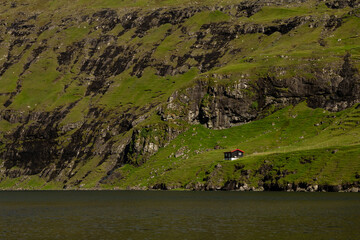 A traditional house perched on a mountain near Saksun, Faroe Islands.