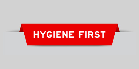 Red color inserted label with word hygiene first on gray background