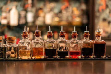 Cocktail ingredients in a bar, captured in moody, atmospheric low light, ready for mixing.