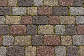 Paving slabs for paths. Paving slabs made of cement mix. Paving stones made of artificial materials. Laying tiles on the road. Material for covering sidewalks and streets. Repair of sidewalks