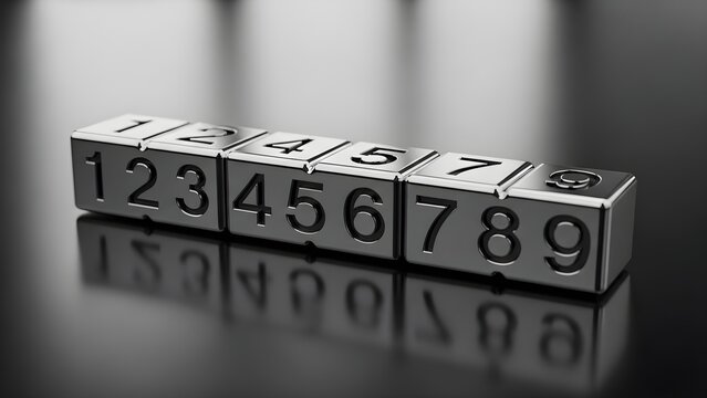 A close up of metallic blocks displaying numbers from one to nine on a reflective surface