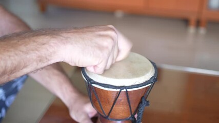 Explore the Dynamic Hand Drumming Techniques on a Djembe to elevate your musical skills