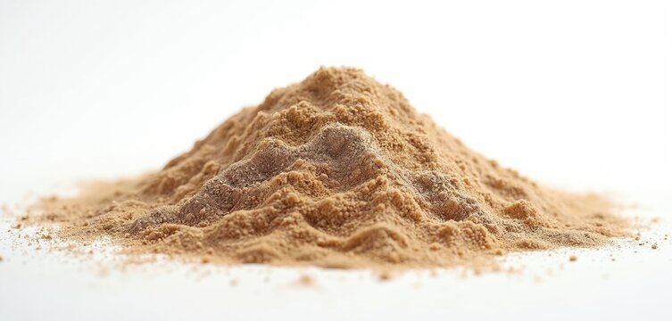 Heap of brown powder on white background. Pile of organic product for bakery or food. Ingredient, spice, cereal or supplement close up shot. Healthy meal, organic product.
