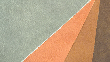 Fototapeta premium Abstract textured background of multicolored leather pieces with small pattern for web banner template or wallpaper design.