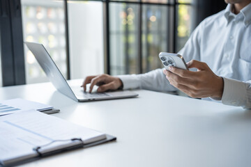 Successful Businessman Using Smartphone During Office Work