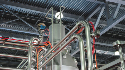 Food production machine with stainless steel pipes, cooling radiator as separator and tanks, valves and measuring instruments