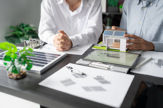 Solar panels green energy Business man working green eco friendly office business creative idea Planing Bio economy for business eco friendly professional Engineer sustainable electricity. - Powered by Adobe