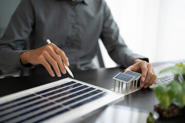 Solar panels green energy Business man working  green eco friendly office business creative idea Planing Bio economy for business eco friendly professional Engineer sustainable electricity