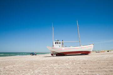 boats on a beach in denmark