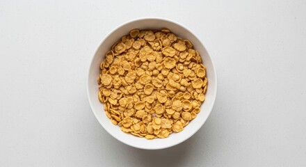 Bowl of crunchy breakfast cereal on white surface