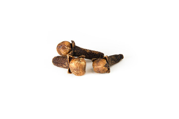 Three whole dried clove spice buds grouped on white background