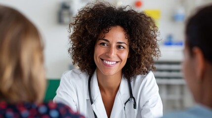 Woman doctor smiling at camera in office.
