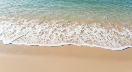 Tranquil ocean waves gently washing onto pristine sandy beach shoreline
