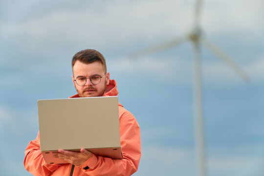 Engineer checking data at wind farm