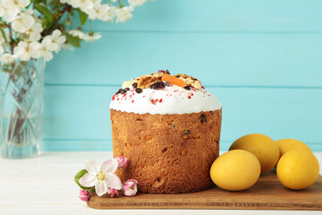Traditional easter cakes with colorful sprinkles, with eggs, a bunny figurine, and spring flowers, creating a festive holiday scene