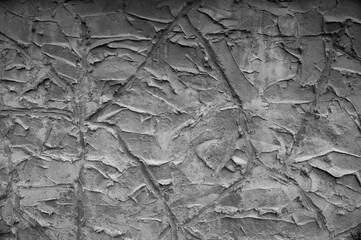 gray background, in the photo the texture of a gray wall with various lines, strokes and cracks