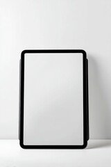 Fototapeta premium Black tablet on white surface copy space