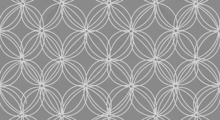 Fototapeta premium Intricate geometric pattern featuring overlapping circles and symmetrical design in monochrome
