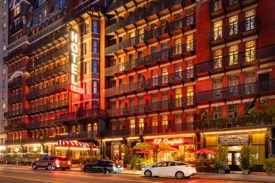 New York City, NY, USA &ndash; August 26, 2025: The historic Hotel Chelsea's neon sign and iron-balcony facade. The Manhattan landmark was the home of iconic artists and literary figures