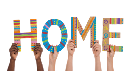 Colorful multiracial child hands holding letters that form the word home in a cheerful display of creativity at a friendly gathering