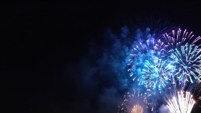 Vibrant fireworks illuminating the night sky create a festive celebration, perfect for New Year's Eve or Independence Day events and celebrations
