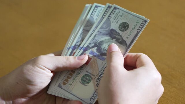 Fanning and Refanning USD Bills by Hand Over Tabletop