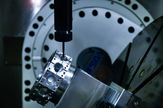 Spindle cutting tool Rotary 5-axis CNC milling machine during deburring of engine parts, heavy industry plan	