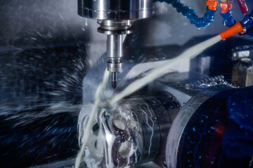 CNC milling machine cutting the mold parts with oil coolant method The mold and die manufacturing...