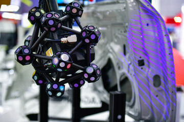 3D scanner on robotic arm measure the accuracy of large automotive parts. in industrial plants