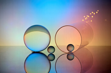 Glass items with colorful background 