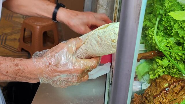 Traditional Turkish Street Food Chef Preparing Cig Kofte Wrap in Istanbul