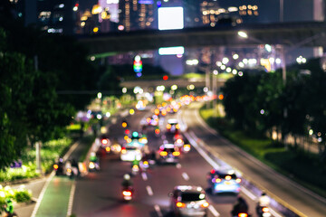 Fototapeta premium Defocused photo. Blurred of car in city at night, bokeh background. After edits.