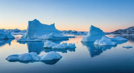 Scenic landscape of icebergs floating in the arctic waters at sunrise