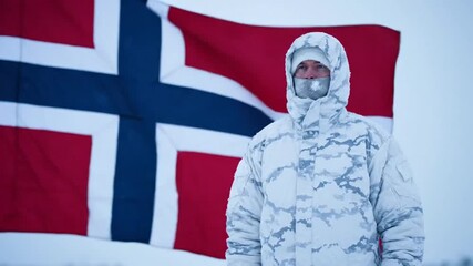 Person in Protective Suit Standing in Front of Norwegian Flag with Multiple