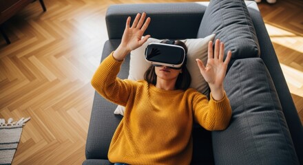 Young caucasian female experiencing virtual reality on sofa