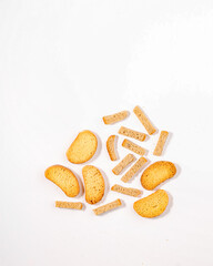 Crispy Golden Rusks and Rye Croutons on White Background