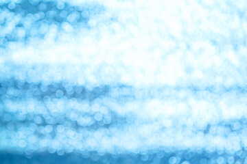 Blurred bokeh blue foil texture background.